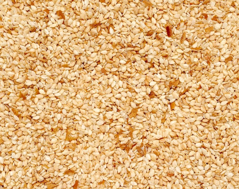 Full frame closeup of mostly sesame seeds