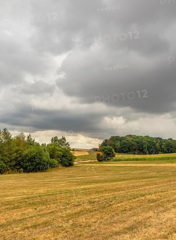 Stormy farmland scenery in Hohenlohe, an area in Southern Germany at late summer time