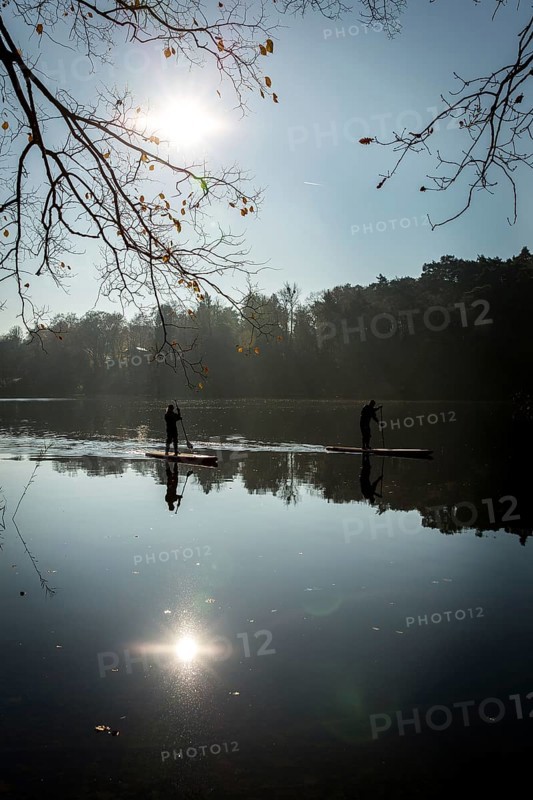 DEU Germany Germany Berlin Standup paddler (SUP) on the Krumme Lanke