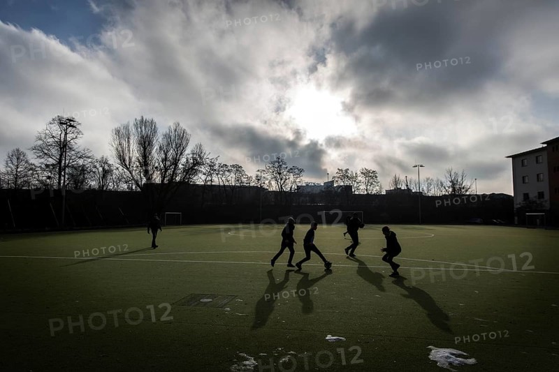 DEU Germany Germany Berlin Sports ground on Eisackstrasse in Berlin-Schöneberg. Refugees from a welcome class at a neighbouring school play football