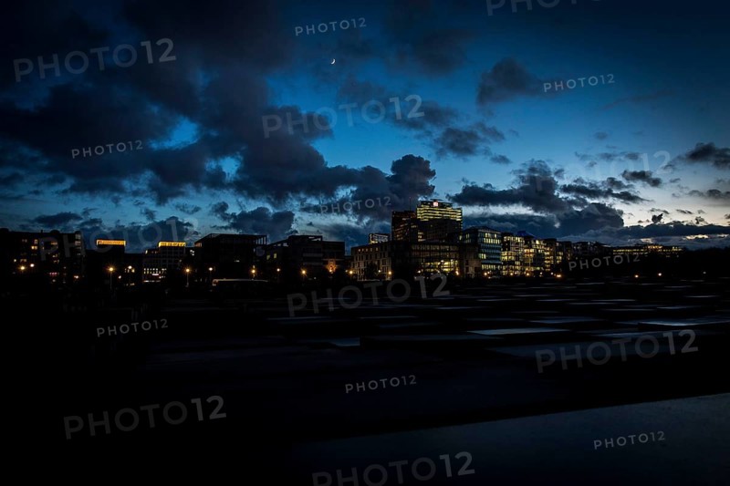 DEU Germany Germany Berlin The Holocaust Memorial at blue hour under a cloudy sky in the direction of Potsdamer Platz