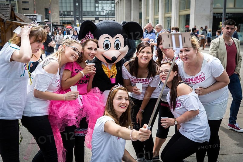 DEU Germany Germany Berlin Selfie with Mickey Mouse actor during a bachelorette party on Alexanderplatz