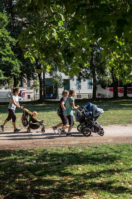 DEU Germany Germany Berlin Jogging mothers with prams in Monbijoupark in Mitte