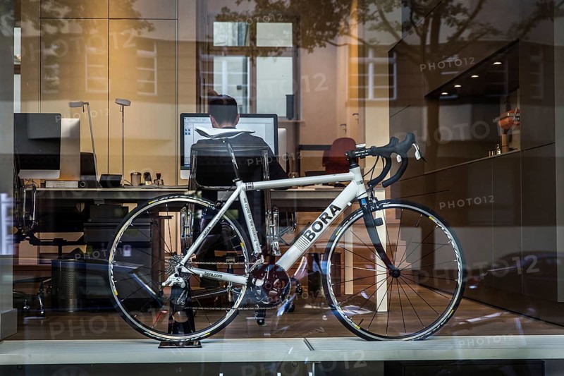 DEU Germany Germany Berlin Bicycle in an office window in Konstanzer Straße