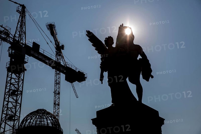DEU Germany Germany Berlin The shell of the city palace backlit with statues on the bridge