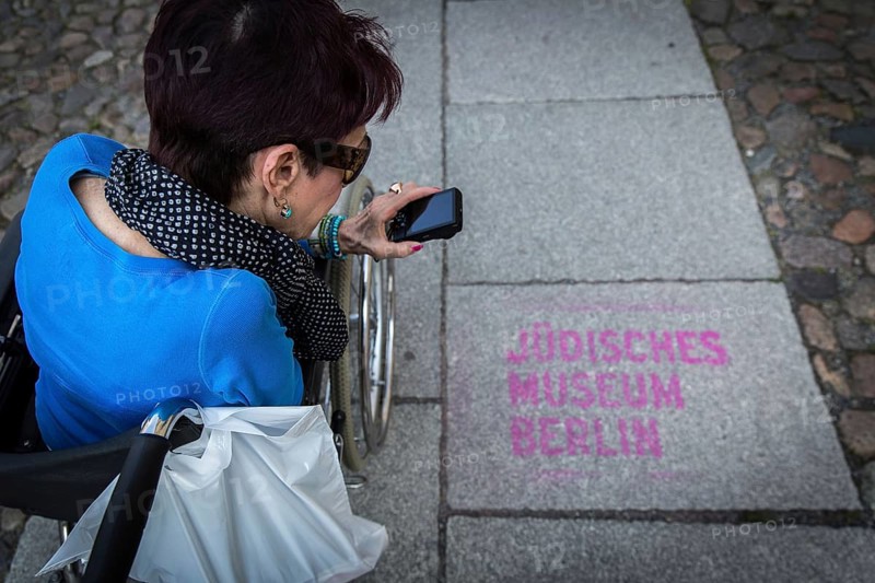 DEU Germany Germany Berlin Disabled tourist in a wheelchair explores Berlin with a city guide. Visit to the Jewish Museum