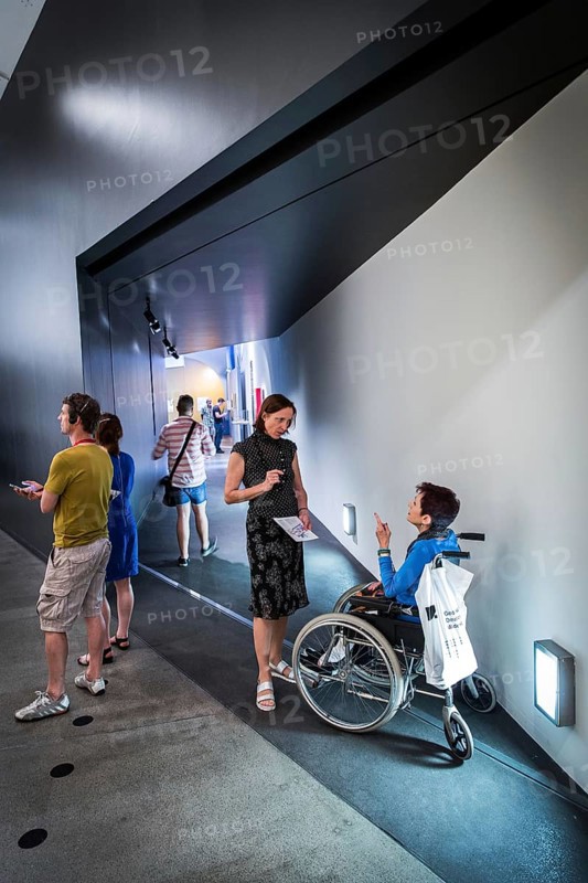 DEU Germany Germany Berlin Disabled tourist in a wheelchair explores Berlin with a city guide. Visit to the Jewish Museum