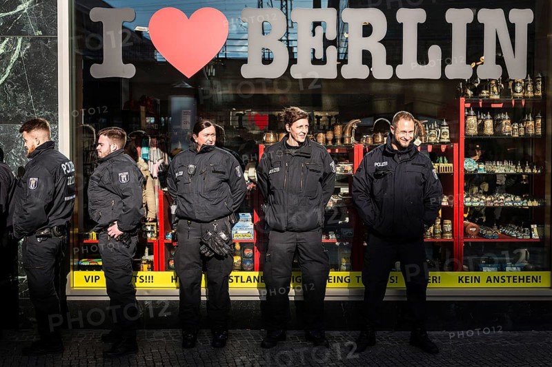 DEU Germany Germany Berlin Police officers stand in front of a souvenir shop at Alexanderplatz
