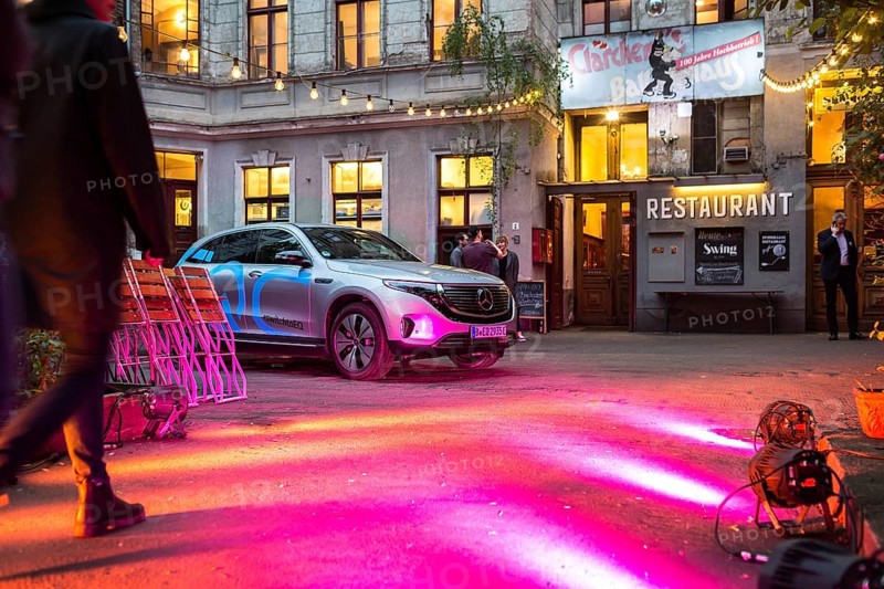 DEU Germany Germany Berlin Spotlights bathe the entrance to Clärchens Ballhaus in red light. Part of a Mercedes Benz promotional event for the new EQ electric car