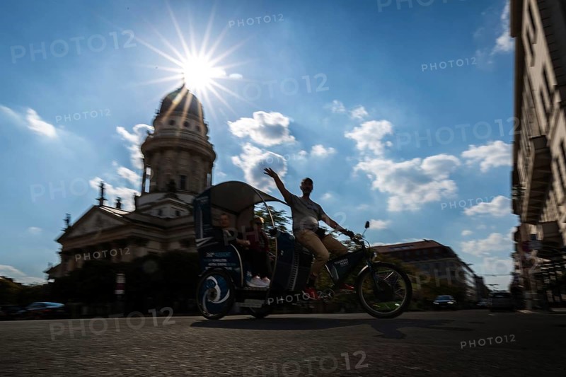 DEU Germany Germany Berlin A rickshaw driver shows his passengers the city
