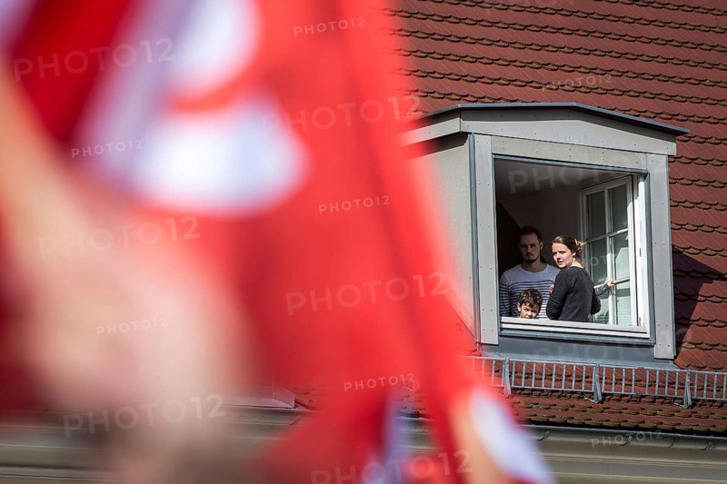 DEU Germany Germany Berlin Election campaign appearance of SPD chancellor candidate Martin Schulz. Family watches the election rally from the window of their penthouse flat
