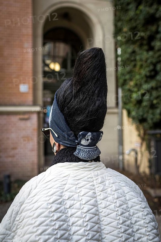 DEU Germany Germany Berlin Visitor to the Berlin Literaturhaus Café with a fashionable hairstyle
