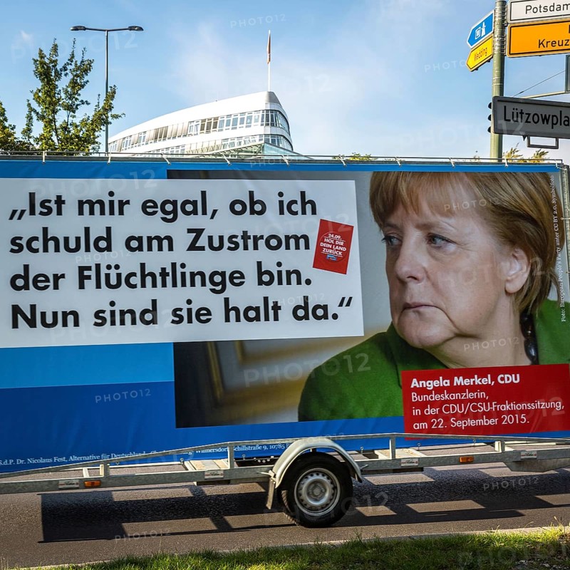 DEU Germany Germany Berlin Supporters with AFD poster against Merkel's refugee policy in front of the CDU's Konrad Adenauer House