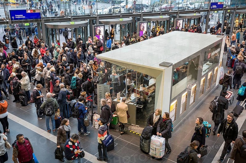 DEU Germany Germany Berlin Scenes at Berlin Central Station after storm Xavier. All long-distance traffic was paralysed until midday. Travellers around the information desk