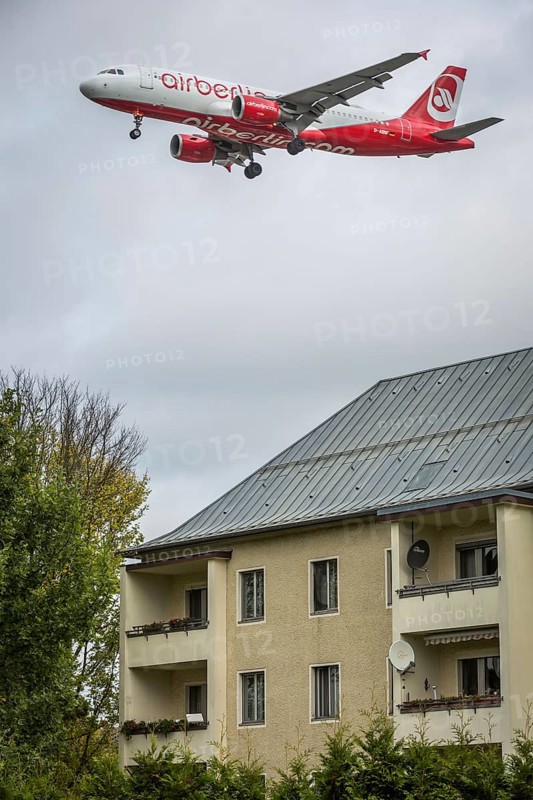 DEU Germany Germany Berlin Landing approach of an Air Berlin aircraft over residential buildings at Tegel Airport. The airline will cease flight operations on 28 October