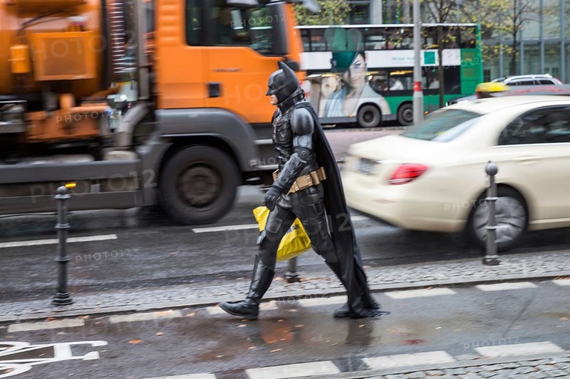 DEU Germany Germany Berlin A man wearing a Batman costume walks across Potsdamer Platz