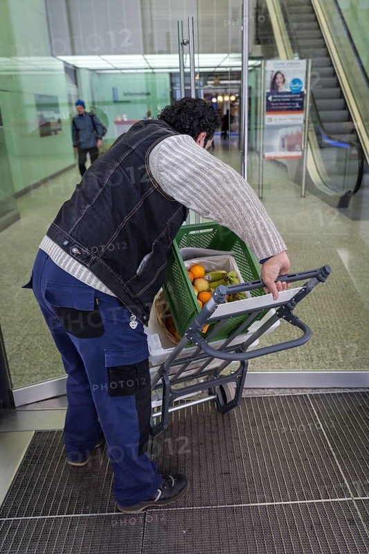 DEU Germany Germany Berlin A courier with food orders enters the European Centre