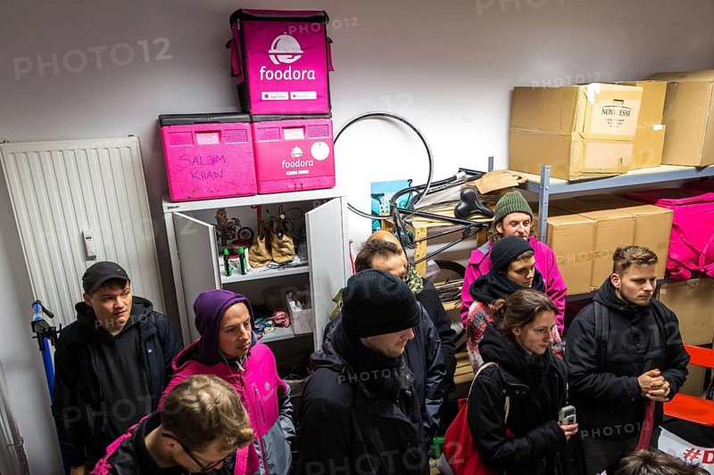 DEU Germany Germany Berlin Foodora bike couriers protest against poor working conditions and unequal pay in front of their distribution centre (hub) in Ackerstraße