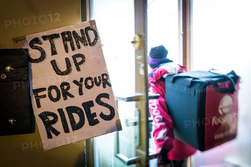DEU Germany Germany Berlin Foodora bike couriers protest against poor working conditions and unequal pay in front of their distribution centre (hub) in Ackerstraße