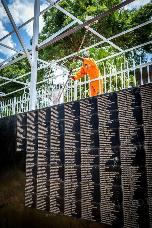 RWA RWANDA RUANDA Kigali Working at the memorial in front of a list of names in preparation for the commemoration of the anniversary of the genocide