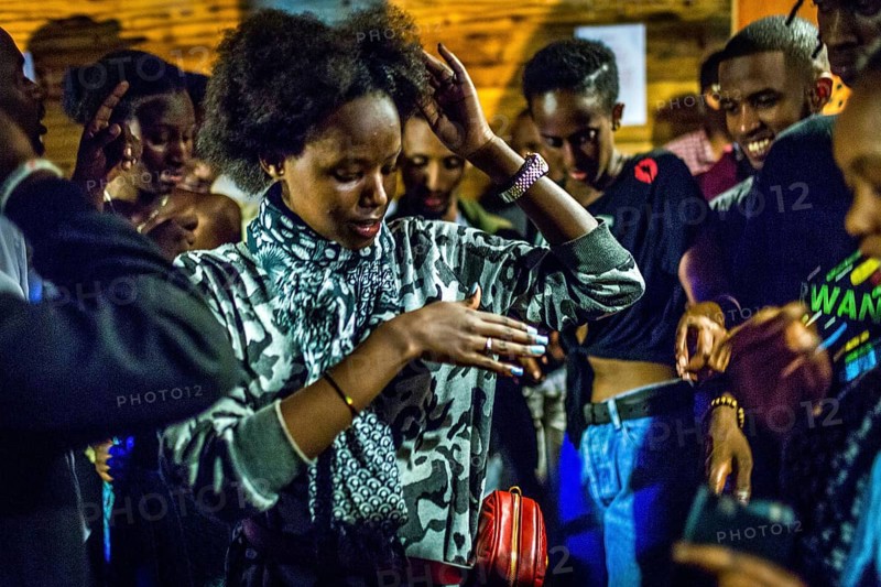 RWA RWANDA RUANDA Kigali Guests at a regular party organised by the Inema Gallery. Artists, locals and expats meet here every Thursday