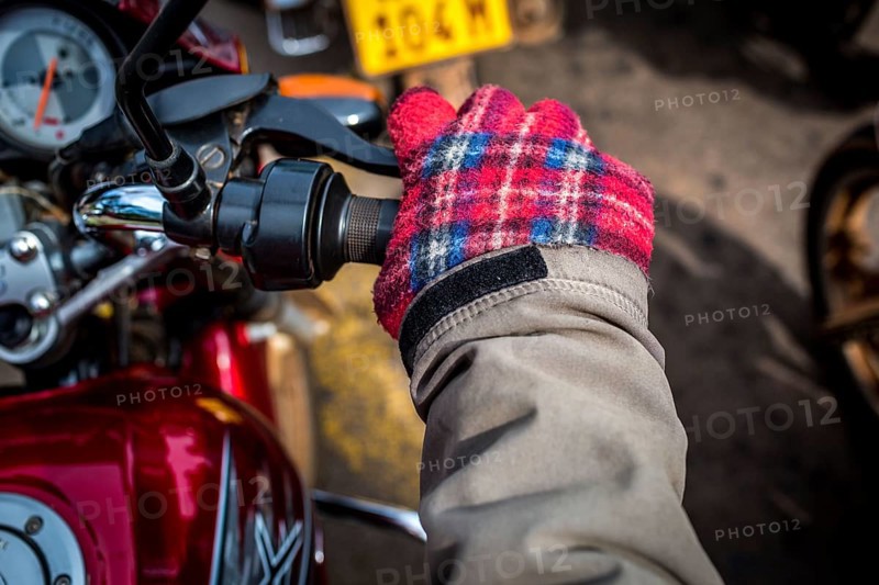 RWA RWANDA RUANDA Kigali A taxi driver with home-made chequered gloves