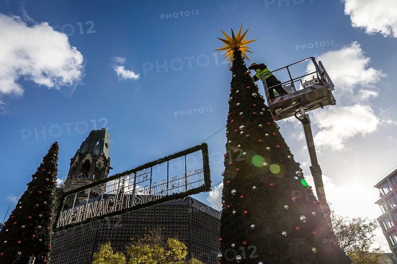 DEU Germany Germany Berlin Setting up the Christmas market at Breitscheidtplatz. The memorial church in the background