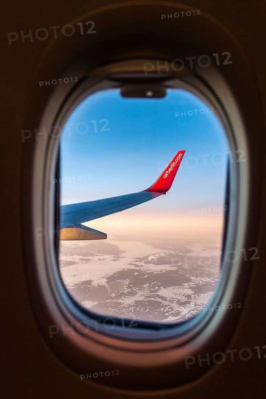 Egypt Hurghada aeroplane with Air Berlin lettering over snowy mountains