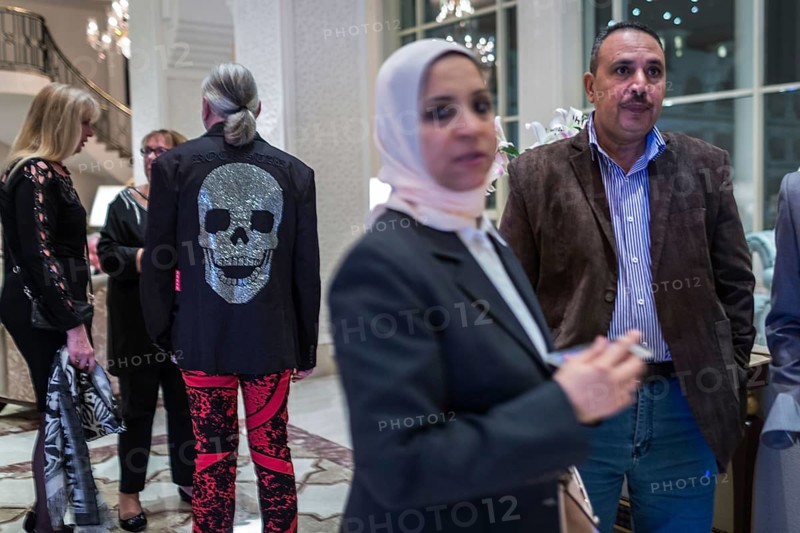 Egypt Hurghada Guests wait in a hotel lobby for the start of an event. One guest is wearing a jacket with a skull and crossbones