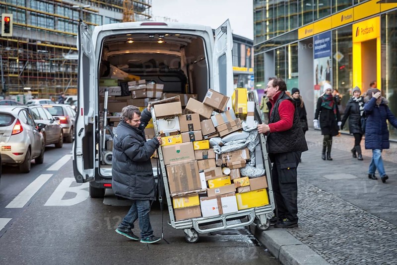 DEU Germany Germany Berlin Courier drivers load parcels and packages in front of a post office near Bahnhof Zoo