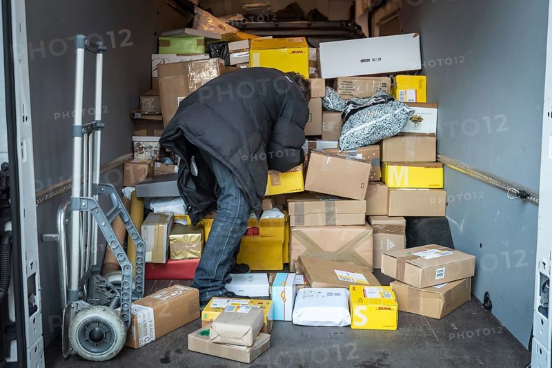 DEU Germany Germany Berlin Courier drivers load parcels and packages in front of a post office near Bahnhof Zoo