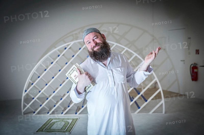 DEU Germany Germany Berlin The head of the Ibn Rushd Goethe Mosque, Christian Hermann, poses in the prayer room. The mosque is located on the premises of the Protestant St John's Church in Moabit