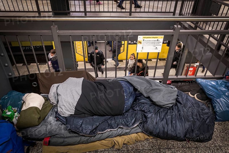 DEU Germany Germany Berlin Homeless people spend the night in a passageway at Lichtenberg underground station. Like Moritzplatz, the station has been made available by the BVG for overnight stays during the winter months