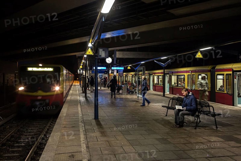 DEU Germany Germany Berlin Scenes in and around the S-Bahn. Passengers waiting for a train in Pankow-Heinersdorf