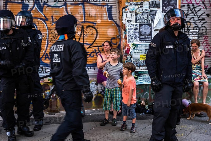 DEU Germany Germany Berlin Scene from Rigaer Straße, where squatters protest against the further gentrification of their neighbourhood. Riot police on duty during a party in a squat, confiscating chairs that guests had been sitting on in the street
