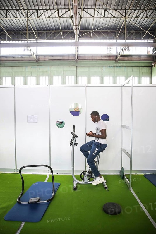 DEU Germany Germany Berlin As part of the German Foundation Week, the Cologne-based organisation Rheinflanke demonstrates sports facilities for refugees in the hangar at Tempelhof Airport. African refugees do exercises in a weight room in Hangar 1