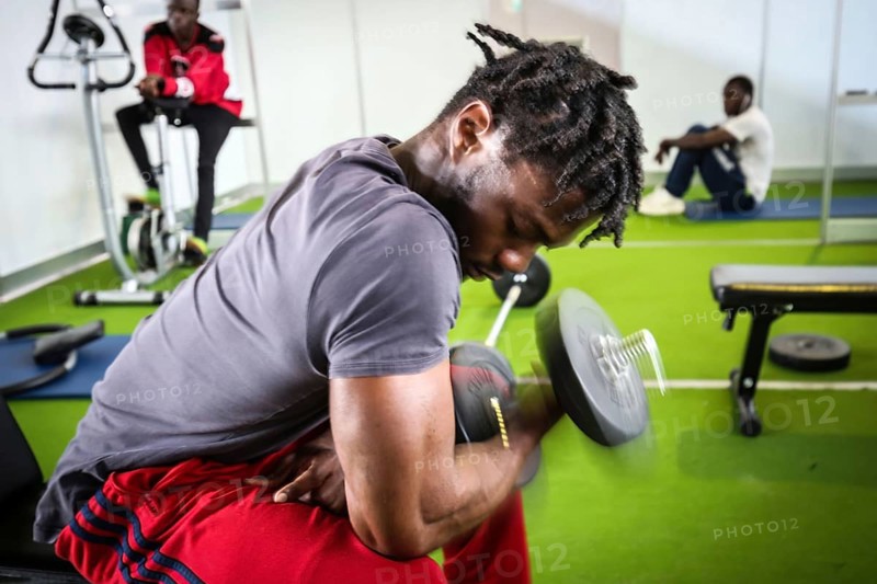 DEU Germany Germany Berlin As part of the German Foundation Week, the Cologne-based organisation Rheinflanke demonstrates sports facilities for refugees in the hangar at Tempelhof Airport. African refugees do exercises in a weight room in Hangar 1