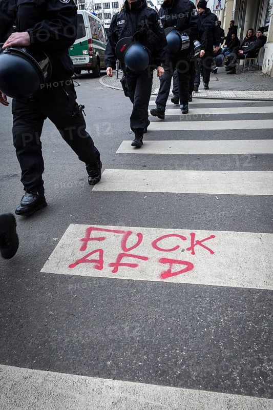 DEU Germany Germany Berlin Demonstration ' March of Women, which was organised by AFD member, the Kurdish woman Leyla Bilge. The protest was directed against the sexism of asylum seekers and the German government's immigration policy.graffiti by counter-demonstrators on a zebra crossing at Hallesches Tor