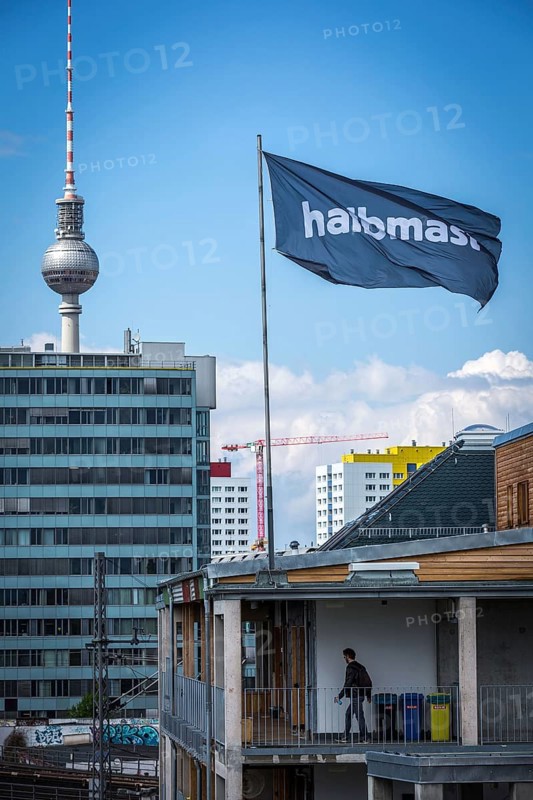 DEU Germany Germany Berlin The alternative project Holzmarkt on the banks of the Spree The flag 'half-mast' flies over the Holzmarkt