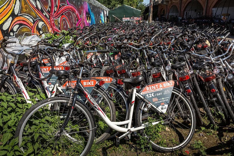 DEU Germany Germany Berlin Rental bikes in the city.bikes from the provider berlinandbike.com are parked on a site at the S-Bahn arches behind Zoo station