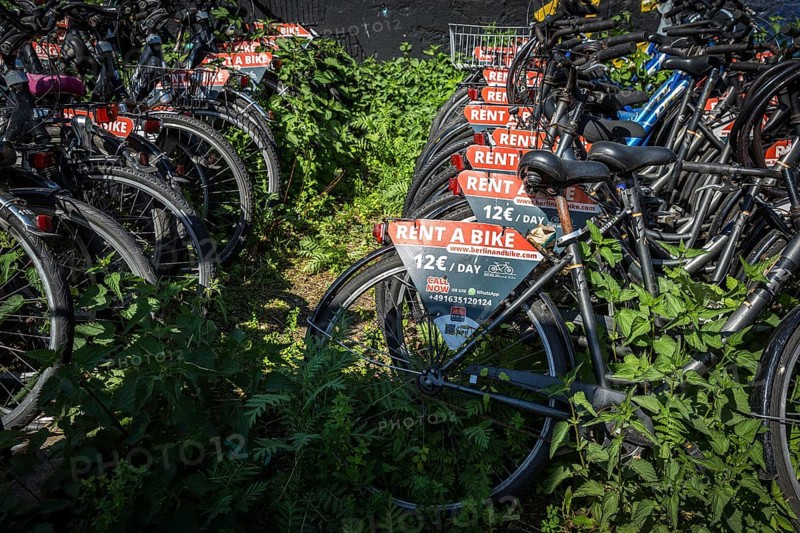 DEU Germany Germany Berlin Rental bikes in the city.bikes from the provider berlinandbike.com are parked on a site at the S-Bahn arches behind Zoo station