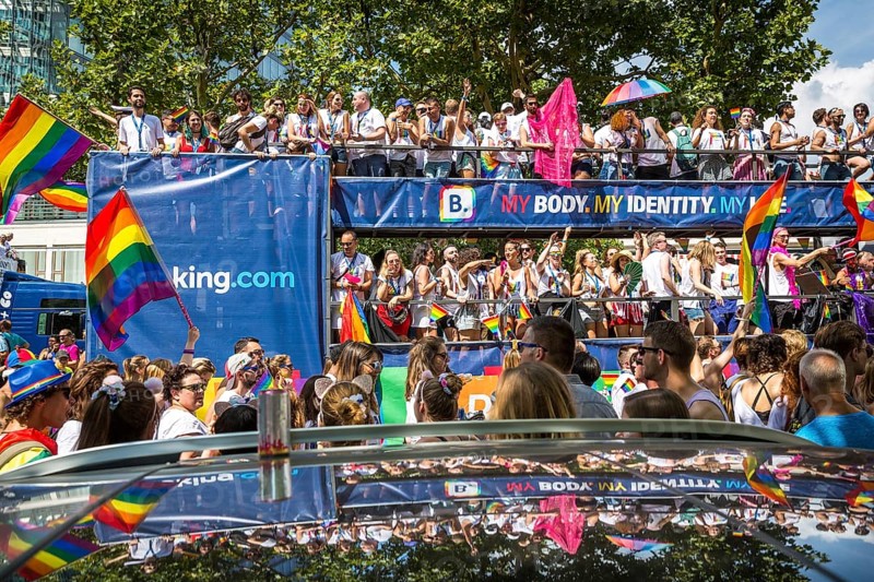 DEU Germany Germany Berlin Scenes of the Christopher Street Day CSD on a hot Saturday . The car from booking.com