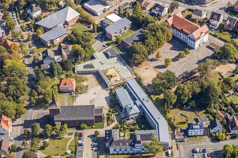 Aerial view, Catholic Church of the Holy Cross, Lessing School, Caritas Association Hamm, Caritas Home for the Elderly St. Josef, construction site, new building, Haus der Begegnung, Herringen, Hamm, Ruhr area, North Rhine-Westphalia, Germany, retirement home, retirement home, place of worship, construction work, construction, construction area, building site, building plots, construction project, construction site, care and nursing, education, educational institution, Buschkampstraße, DE, Europe, religious community, house of worship, primary school, Holzstraße, church, parish, denomination, educational institute, aerial view, aerial photography, aerial photography, new building, care facility, religion, school, retirement home, retirement home, retirement home, retirement centre, overview, bird's-eye view, bird's-eye view, overview