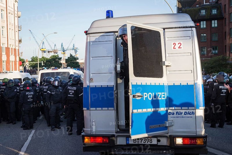 DEU Germany Germany Hamburg Protests in front of and during the 'Welcome to hell' demonstration in the run-up to the G20 summit. Berlin police officer looks out of his squad car