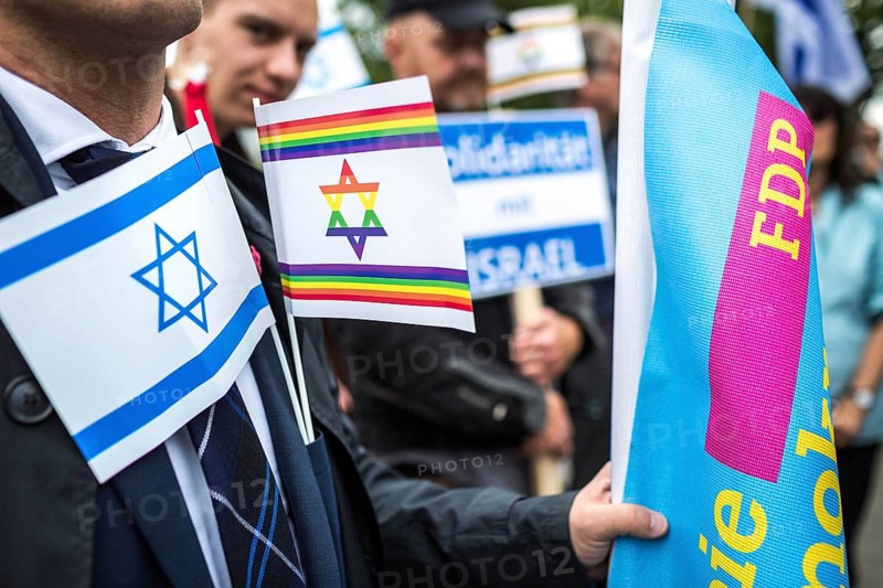 DEU Germany Germany Berlin Pro-Israel demonstration on Kurfürstendamm towards Breitscheidtplatz. Participants with Israel flag, rainbow flag and FDP flag