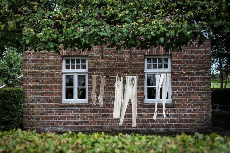 DEU Germany Germany Moordorf Historic clothing hangs on a washing line at the Moor Museum. The museum shows the poor conditions under which moor engravers worked in the 19th century