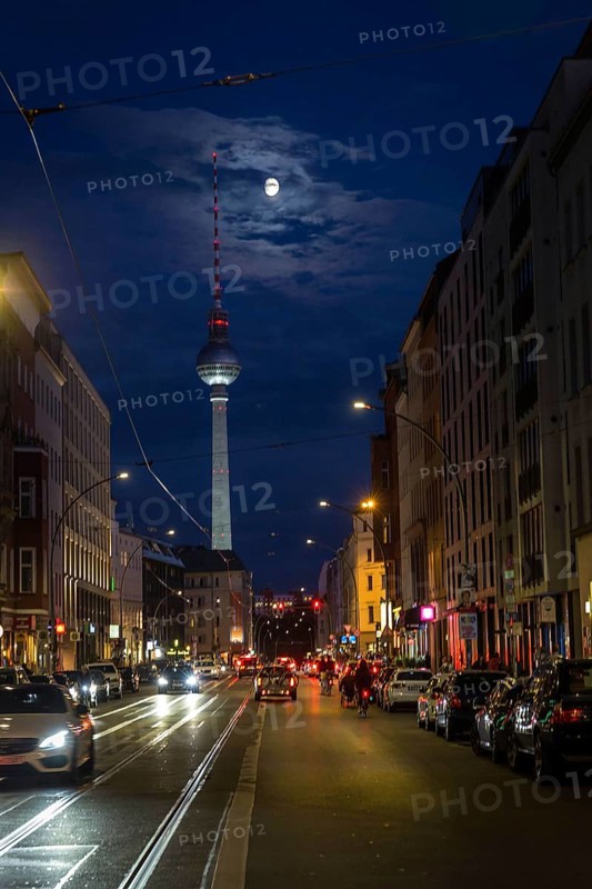 DEU Germany Germany Berlin View through Brunnenstraße with TV tower and moon at the blue hour