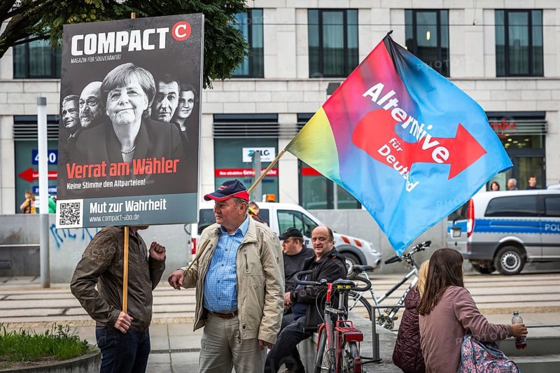 DEU Germany Germany Dresden Pegida demonstration in the city centre. AFD flag and Merkel protest