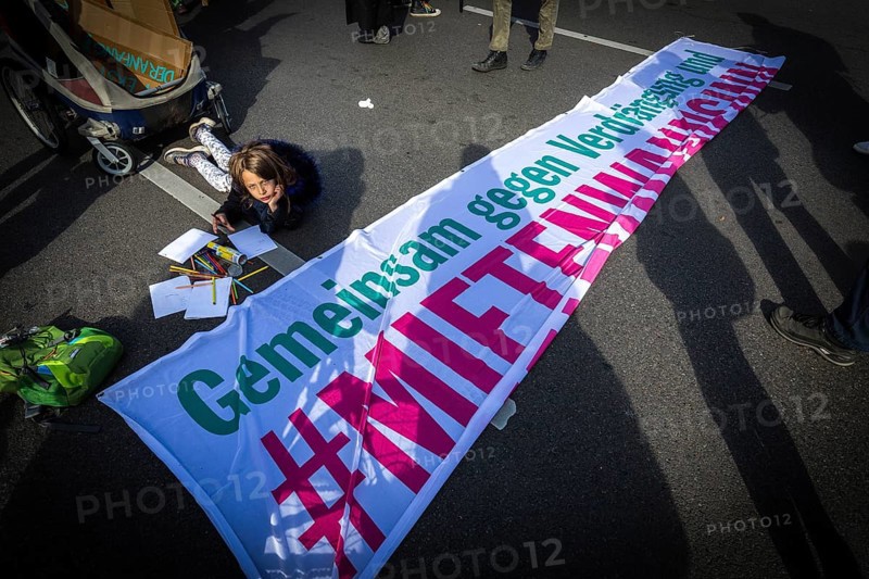 DEU Germany Germany Berlin Demonstration against rent increases and gentrification.child paints in front of the start of the protest march