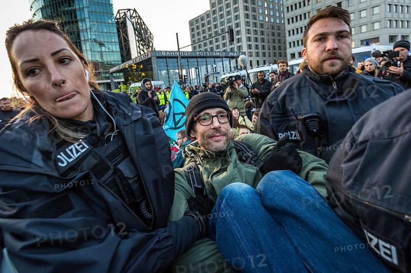 DEU Germany Germany Berlin Demonstrators of the Extinction Rebellion movement during the occupation of Potsdamer Platz.police officers clear activists of a sit-in blockade on Potsdamer Platz